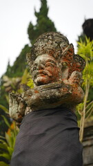 Obraz premium Ancient Balinese Stone Deity Statue