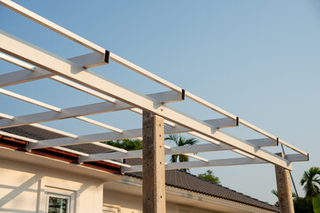 Fototapeta premium Construction of modern pergola structure in outdoor space architectural bright day