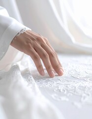 Elegant white wedding dress detail close-up of a delicate female hand resting on intricate lace fabric soft natural light illuminates the scene
