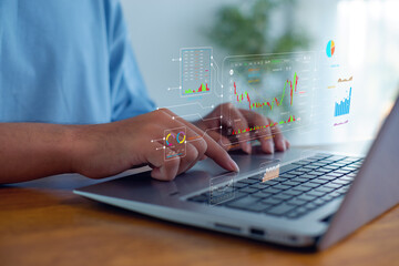 Person analyzing stock market charts on laptop with virtual financial dashboard, showing trading data, investment analytics, business intelligence, fintech innovation, and strategy.
