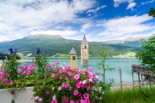 Submerged church tower of Alt Graun in Lake Reschen in South Tyrol, Italy