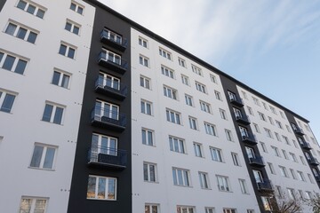 Reconstructed facade on white block of flats in Czechia