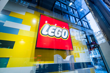 Naklejka premium Munich Germany, 25 december 2025, LEGO Store logo on the facade of an official LEGO store.
