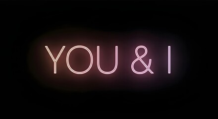 Obraz premium Neon glowing text 'YOU & I' on a dark background, creating a romantic and intimate atmosphere.