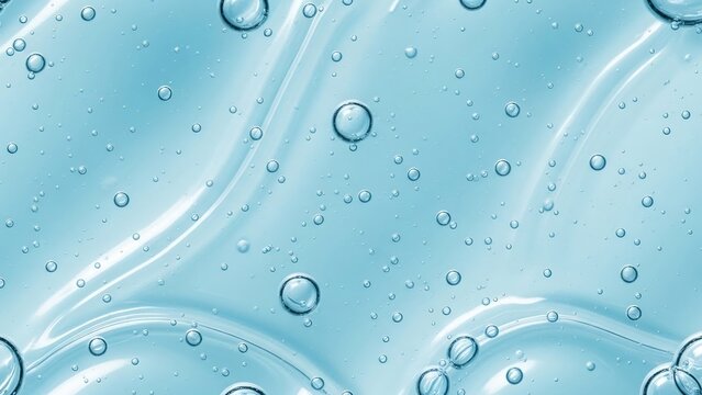 Abstract light blue gel texture with small and large translucent bubbles and smooth wavy patterns, representing liquid science or skincare