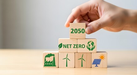 Hand Placing 2050 Block on Net Zero Goal with Eco and Industry Icons