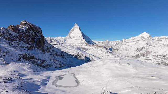 Frozen Riffelsee lake with Matterhorn view. Zermatt, Valais, Switzerland.