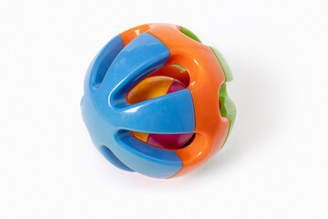 Colorful plastic rattle ball toy for babies and toddlers isolated on white background