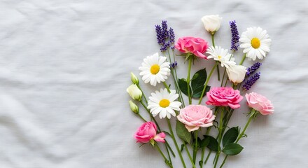 Delicate bouquet of pink roses, white daisies, and lavender on a textured fabric background.
