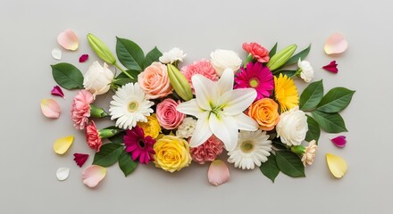 Colorful mixed flower arrangement with lily, roses, gerberas, and daisies on grey.
