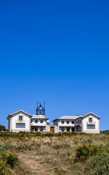 Historic lighthouse under clear blue sky