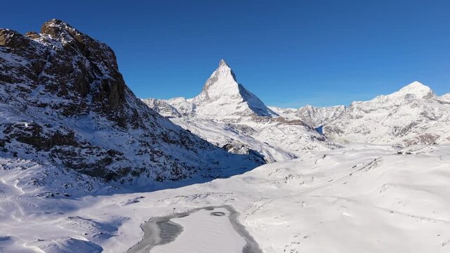 Frozen Riffelsee lake with Matterhorn view. Zermatt, Valais, Switzerland.