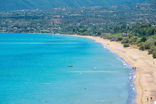 Long-Distance Panoramic View of the Golden Sands and Turquoise Waters of Zagas Beach in Koroni, Messinia, Greece