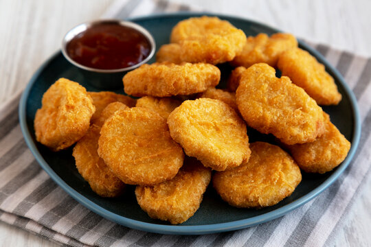 Chicken Nuggets with Sweet Chili Sauce on a Plate, side view.