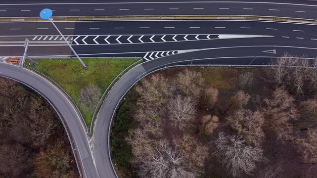 Road Junction Aerial View: An aerial perspective of a complex road junction, showcasing the intricate web of asphalt and markings.