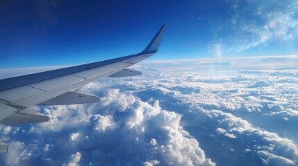 Airplane Wing with Blue Sky Clouds and Horizon View