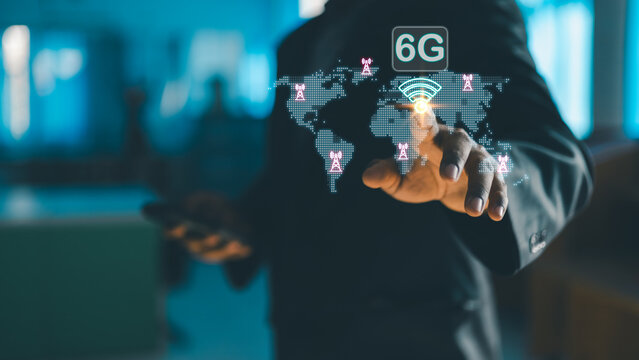 Businessman interacting with virtual world map and 6G wireless network interface, representing future global communication, ultra fast connectivity, and next generation digital technology. - Powered by Adobe