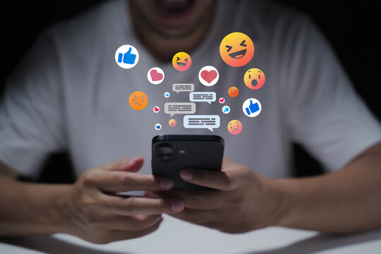 A man's hand is using a laptop or smartphone to chat on social media; communication concept, social networking, contact, online.
