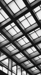 A gray-scale architectural ceiling shows a grid of square windows, with diagonal beams and repeating geometry