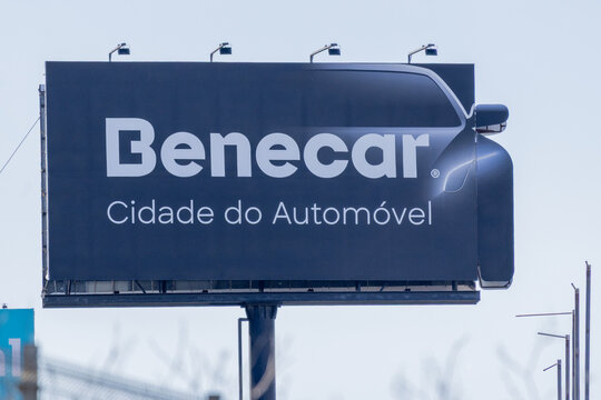 Benecar advertisement on billboard showing car silhouette in cidade do automovel