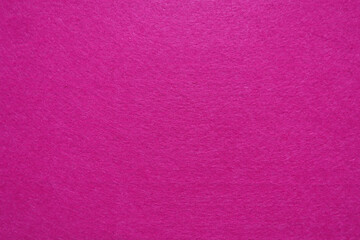 Fototapeta premium Solid pink felt fabric texture background