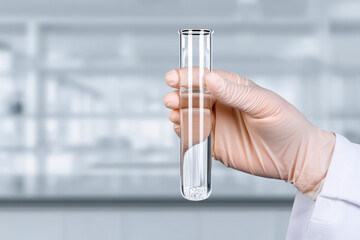Scientist hand wearing glove holding test tube with clear liquid and white pellets in laboratory environment for research and experiment