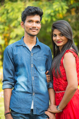 Obraz premium Portrait of happy brother and sister at outdoor