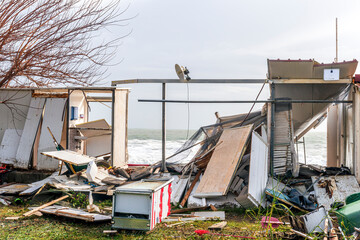 ruins and distructions cousea by a devastating typhoon on a sea coast. elimination of the damage and distructions caused by the hurricane to the coast © Yaroslav