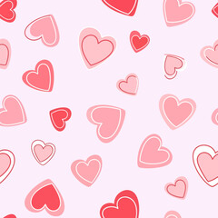 A colorful pattern of pink and red hearts.