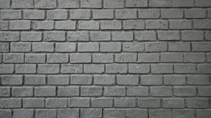Fototapeta premium A gray brick background with a uniform pattern. The rough texture of the gray brick wall showcases minor cracks, coarse mortar joints, and dirt stains.