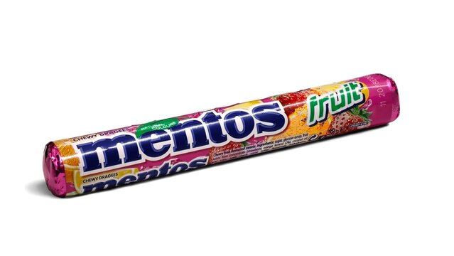 Photo of a Mentos fruit chewy dragees roll, a brand of packaged scotch mints or mint-flavored candies owned by the Italian-Dutch company, Perfetti Van Melle.