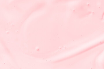 Smooth pink cream texture background with subtle swirls and soft ambient lighting.