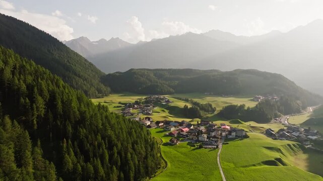 Aerial landscape of Umhausen in Otztal Valley Austria featuring alpine village architecture green valleys and mountain scenery in a popular European travel area