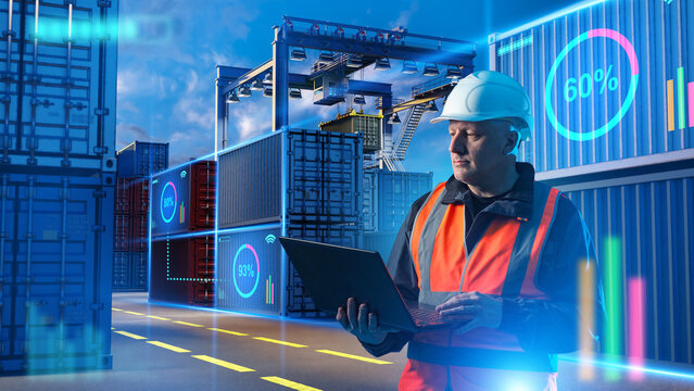 Container terminal logistics, cargo monitoring and smart port operations as a logistics manager analyzes shipment data on a laptop among shipping containers.