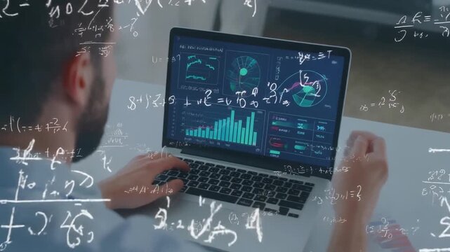 A person working on a laptop with mathematical equations and graphs on the screen, demonstra.