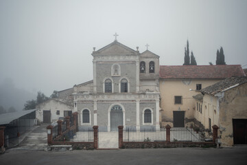 Fototapeta premium Facade of the Hermitage of Light in the El Valle Natural Park, Murcia, Spain, on a foggy day