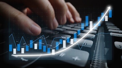 Close-up view of hands typing on a keyboard with a digital stock market graph overlay, symbolizing finance analysis, growth trends, and business strategies. Copula