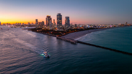 Miami Beach city night aerial view. Miami night coastal cityscape. Miami shoreline. Aerial view of...