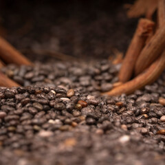 Chia seeds in a wooden bowl with a wooden spoon