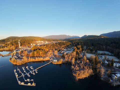 12MP unedited aerial drone view of a marina with boats on a lake at sunset near Rocky Point BC