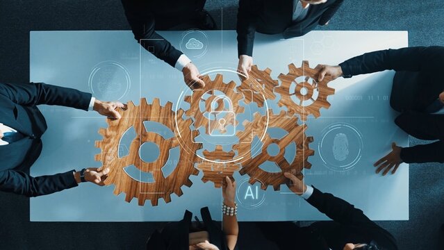 A top view of a diverse business team collaborating around a table, combining gears and tech graphics to illustrate innovative approaches to digital security and efficiency. Raster - Powered by Adobe