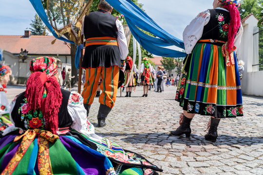 People in traditional embroidred Polish folk costumes from Masovia region at Łowicz Corpus Christi procession	