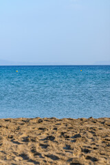 View of the beautiful sea, the sandy beach and the sky in Managanari Ios Greece