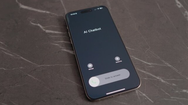 A closeup shows a smartphone receiving an incoming call from an AI Chatbot. The phone is placed on a table with a simple background.