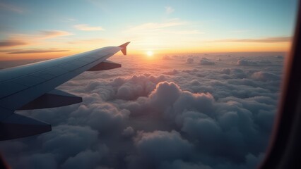 Obraz premium aerial view from airplane window above green ground with beautiful clouds at sunrise earth and sky seen through aircraft window travel scene concept of aviation tourism transportation business