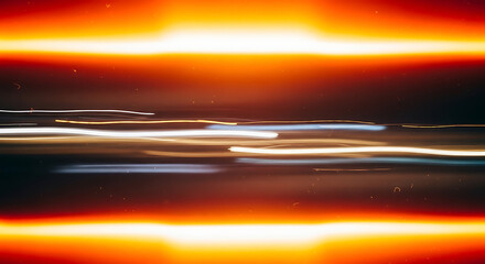 Blurry light trails with orange glow