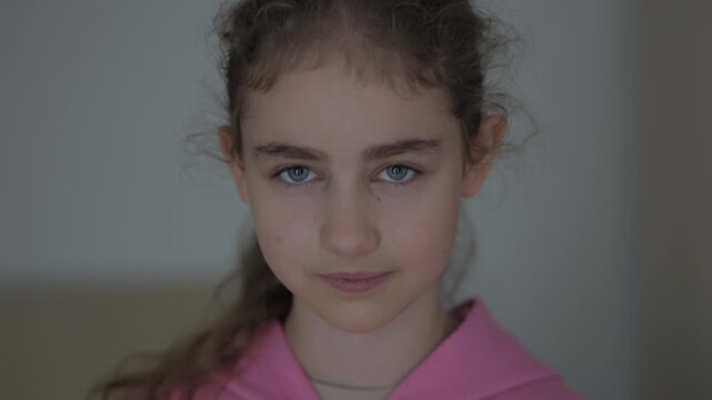 Portrait Close up of Little Girl Showing Agreement Emotion by Shaking Her Head Positively in Home. Kid Says 'Yes'. Face of Happy Child Nodding Head Yes. Young Caucasian Girl Shaking Head to Agree.