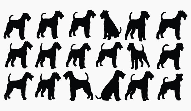 A collection of black silhouettes depicting various poses of airedale terrier dogs