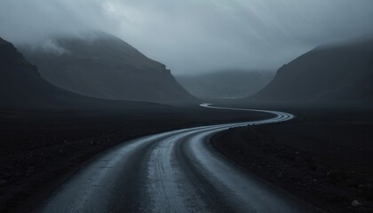 Naklejka premium Curvy wet road winds through dark Icelandic highlands under moody sky. Remote land offers epic journey through volcanic terrain, mist shrouded mountains.
