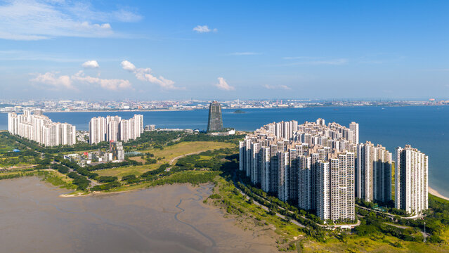 Aerial panoramic view of Forest City, an artificial island, built in Johor Bahru, Malaysia, Singapore can be seen at the distance as background.